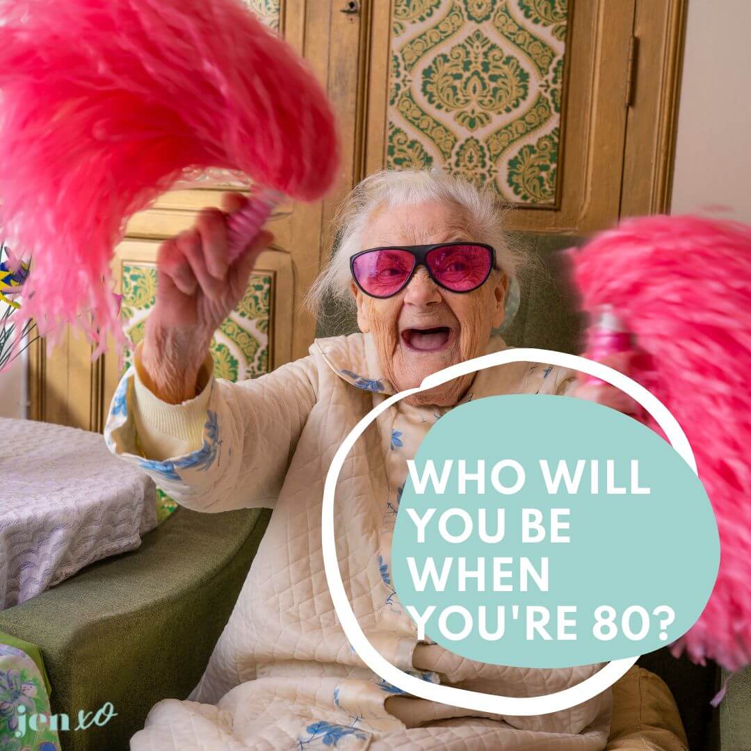 A joyful older woman shaking pink pom poms with the words Who will you be when you're 80 in a blue blob